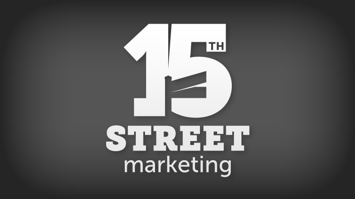 Bold numeral 15 with corner street sign in negative space between the numerals 1 and 5, white logo on dark grey background.